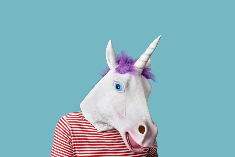 reality of online dating: man in red striped shirt and unicorn mask