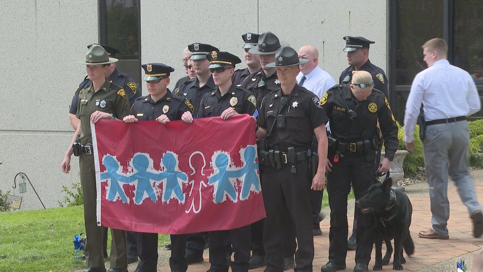Community Gathers in Support of Child Abuse and Neglect Awareness Flag Day