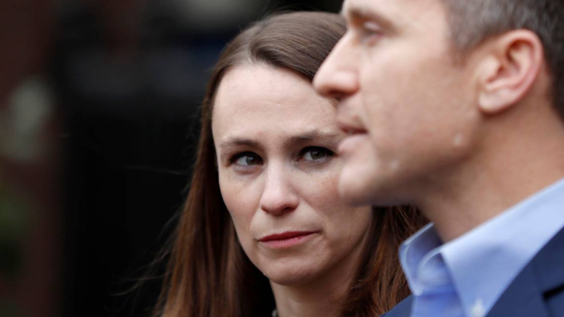 Sheena Greitens, left, listens as her husband, Missouri Gov.-elect Eric Greitens, speaks during a news conference Tuesday, Dec. 6, 2016, in St. Louis.